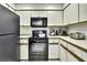 Efficient corner kitchen design with modern appliances at 7233 Royal Oak Dr, Spring Hill, FL 34607