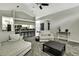 Open-concept floorplan allows clear view from living room through kitchen and breakfast bar at 7233 Royal Oak Dr, Spring Hill, FL 34607