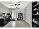 Bright home office featuring sleek desk, large window, and shelving perfect for remote work at 7233 Royal Oak Dr, Spring Hill, FL 34607