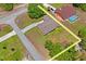 Aerial view of the property showcasing the home, pool, surrounding landscape, and outlined lot lines at 7270 Nightwalker Rd, Weeki Wachee, FL 34613