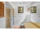 Bright bathroom featuring a glass-enclosed shower, commode, and vanity area at 7270 Nightwalker Rd, Weeki Wachee, FL 34613