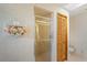 Bathroom showcasing a tiled shower with a glass door, floral decor, and vanity at 7270 Nightwalker Rd, Weeki Wachee, FL 34613
