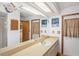 Bathroom with a large vanity, ample lighting, and traditional-style decor at 7270 Nightwalker Rd, Weeki Wachee, FL 34613
