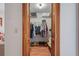 Walk-in closet with wood shutter doors, built-in shelves, clothing rods, and ample storage at 7270 Nightwalker Rd, Weeki Wachee, FL 34613
