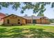 Charming single-story home with unique architectural details and a well-maintained lawn at 7270 Nightwalker Rd, Weeki Wachee, FL 34613