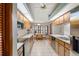 Bright kitchen area with wood cabinets, stainless appliances, and adjoining breakfast nook at 7270 Nightwalker Rd, Weeki Wachee, FL 34613