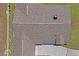 Aerial view of a home's roof showcasing shingles, vents, and chimney at 7270 Nightwalker Rd, Weeki Wachee, FL 34613
