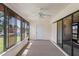 Enclosed sunroom featuring a ceiling fan and access to the exterior at 7270 Nightwalker Rd, Weeki Wachee, FL 34613