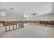 Open-concept living room undergoing renovation with exposed studs at 7300 Southwind Dr, Hudson, FL 34667