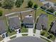 Two story home with a large driveway, attached garage and manicured front lawn and landscape at 733 Old Windsor Way, Spring Hill, FL 34609