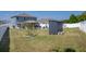 Backyard features a shed, a gazebo with dining, and a gravel seating area at 733 Old Windsor Way, Spring Hill, FL 34609