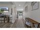 Well lit Hallway leads to open living spaces with views of the outdoor pool at 733 Old Windsor Way, Spring Hill, FL 34609