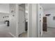 Hallway offering views to a bathroom and bedroom, showcasing an open layout that connects different spaces at 733 Old Windsor Way, Spring Hill, FL 34609