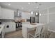 Beautiful kitchen with quartz countertops, a stylish backsplash, and a stainless steel range hood at 733 Old Windsor Way, Spring Hill, FL 34609
