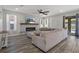 Spacious living room showcasing fireplace, large sofa, and natural light at 733 Old Windsor Way, Spring Hill, FL 34609