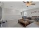 Bright open living space featuring neutral walls, carpet, a large couch, and wood coffee table at 733 Old Windsor Way, Spring Hill, FL 34609