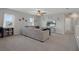 Comfortable living room with a cozy seating area, carpeted floor, and decorative accents for a relaxing atmosphere at 733 Old Windsor Way, Spring Hill, FL 34609