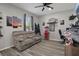 Comfortable Living Room featuring wood-look floors, fan, and sofa at 733 Old Windsor Way, Spring Hill, FL 34609