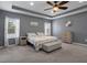 Stylish main bedroom with neutral walls, a comfortable bed, and plenty of natural light at 733 Old Windsor Way, Spring Hill, FL 34609
