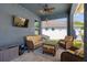 Inviting outdoor patio with comfortable seating and a ceiling fan for relaxing evenings at 733 Old Windsor Way, Spring Hill, FL 34609