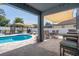 Beautiful pool area with an outdoor gazebo, lounge chairs, and outdoor dining at 733 Old Windsor Way, Spring Hill, FL 34609