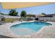 A stunning backyard features a spacious pool, outdoor kitchen, and inviting lounge area at 733 Old Windsor Way, Spring Hill, FL 34609