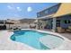 A beautiful pool with a tanning deck and outdoor seating are perfect for entertaining at 733 Old Windsor Way, Spring Hill, FL 34609