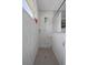 Beautiful shower with a rainfall shower head, white marble style tile walls, and a tiled shower floor at 733 Old Windsor Way, Spring Hill, FL 34609