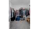 Walk-in closet with hanging rods, shelves, organizers, and ample storage space at 733 Old Windsor Way, Spring Hill, FL 34609