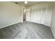 Bedroom with carpeted floor, closet, and doorway to another room at 7538 Landmark Dr, Spring Hill, FL 34606