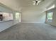 Open floor plan showcasing a large living room that is connected to the kitchen, ideal for entertaining at 7538 Landmark Dr, Spring Hill, FL 34606