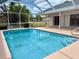 Sparkling pool and deck with serene backyard at 7538 Landmark Dr, Spring Hill, FL 34606