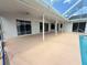 Spacious covered pool deck area offers a seamless transition to the outdoors at 7538 Landmark Dr, Spring Hill, FL 34606