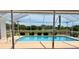 Screened pool and deck with a scenic view at 7538 Landmark Dr, Spring Hill, FL 34606