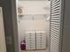 Walk-in closet featuring adjustable shelving and drawers for optimized storage at 7708 Obrien Ct, Hudson, FL 34667