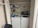 Laundry closet featuring side-by-side washer and dryer at 7708 Obrien Ct, Hudson, FL 34667