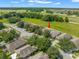 Features an aerial view of the property, showcasing its proximity to green space and neighborhood layout at 779 Nodding Shade Dr, Brooksville, FL 34604