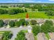 Overhead shot displays the home's layout, white fence, and well-kept lawn at 779 Nodding Shade Dr, Brooksville, FL 34604