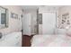 Bedroom showcasing a bed with decorative pillows, white dresser, and closet with wood flooring at 779 Nodding Shade Dr, Brooksville, FL 34604
