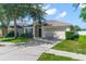 Beautiful single-story home with a two-car garage and manicured lawn at 779 Nodding Shade Dr, Brooksville, FL 34604