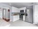 Modern kitchen with stainless steel appliances, white cabinets, and tile floors at 779 Nodding Shade Dr, Brooksville, FL 34604