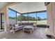 Inviting screened-in patio with comfortable seating, perfect for outdoor relaxation and entertaining at 779 Nodding Shade Dr, Brooksville, FL 34604