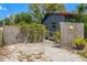 Side yard with fencing and landscaping at 800 N Walton Ave, Tarpon Springs, FL 34689