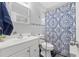 Clean bathroom with a white tile shower and new grab bars on the toilet at 800 N Walton Ave, Tarpon Springs, FL 34689
