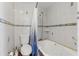 Tile bathroom featuring a large tub, toilet, and shower at 800 N Walton Ave, Tarpon Springs, FL 34689
