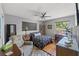 Well-lit bedroom featuring wood floors, a ceiling fan, and modern decor at 800 N Walton Ave, Tarpon Springs, FL 34689