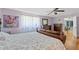 Bedroom with decorative bedding, wood floors, and natural light coming in at 800 N Walton Ave, Tarpon Springs, FL 34689