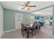 Dining room with wood floors and an open doorway to the kitchen at 800 N Walton Ave, Tarpon Springs, FL 34689
