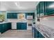 Bright kitchen with granite countertops, new appliances, and lots of cabinet space at 800 N Walton Ave, Tarpon Springs, FL 34689