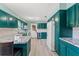 Bright kitchen with granite countertops, modern appliances, and wood floors at 800 N Walton Ave, Tarpon Springs, FL 34689